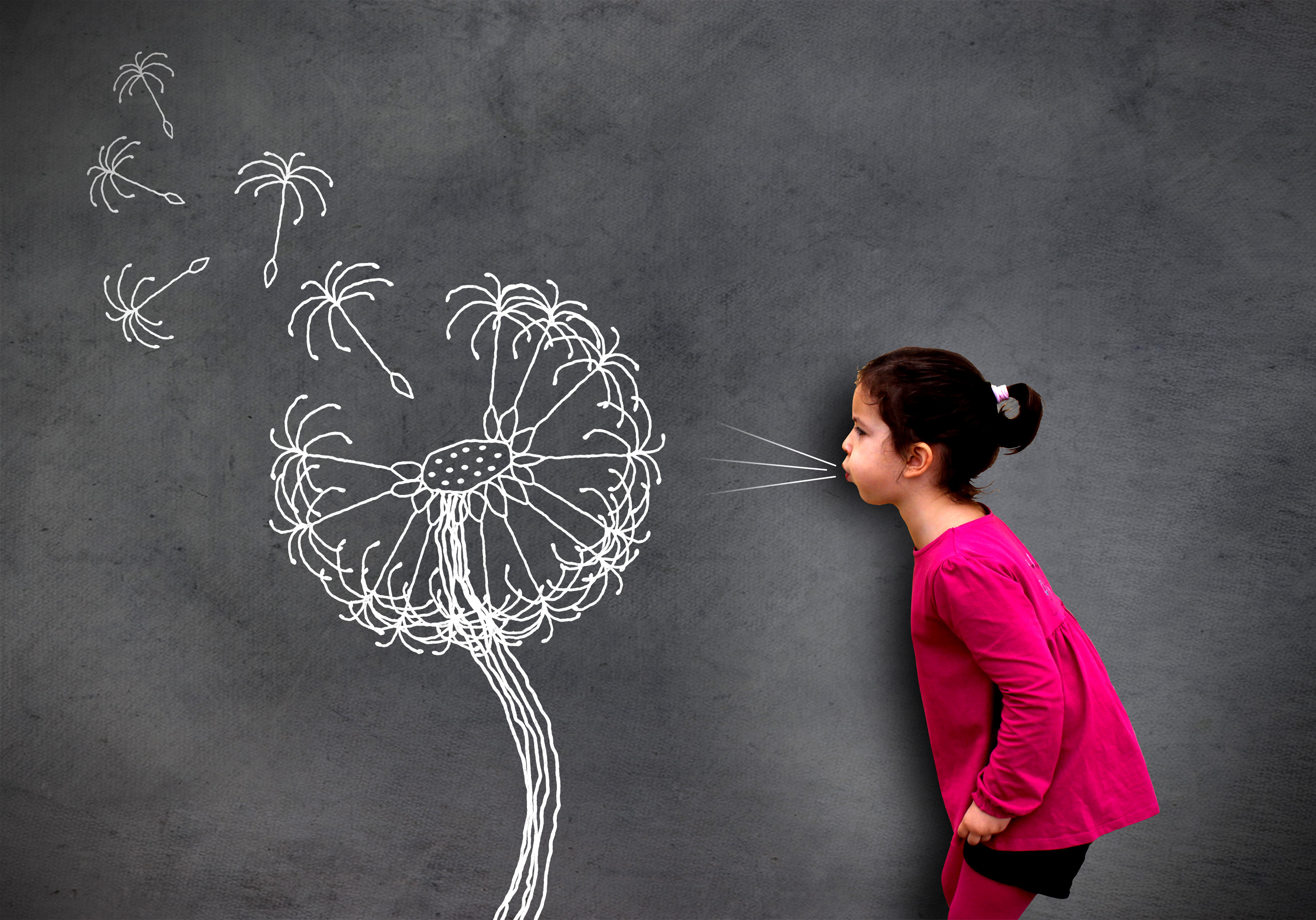 Little cute girl blowing dandelion seeds on chalkboard - Hope an